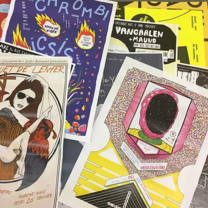 Photo d'un ensemble d'affiches colorées produites par différentes salles de concerts lyonnaises
